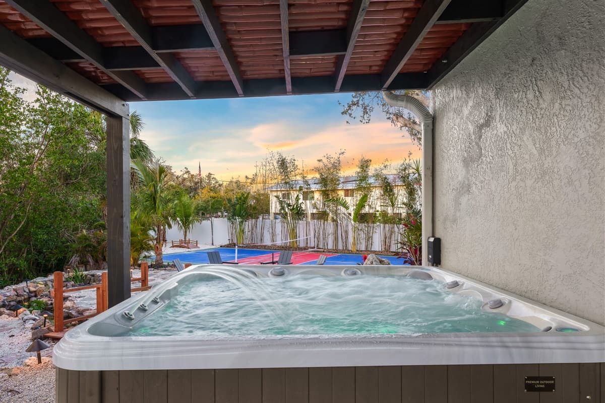 Indulge in the luxurious experience of our private hot tub, nestled beneath a shaded pergola. It's the ideal setting for ultimate relaxation and serenity.