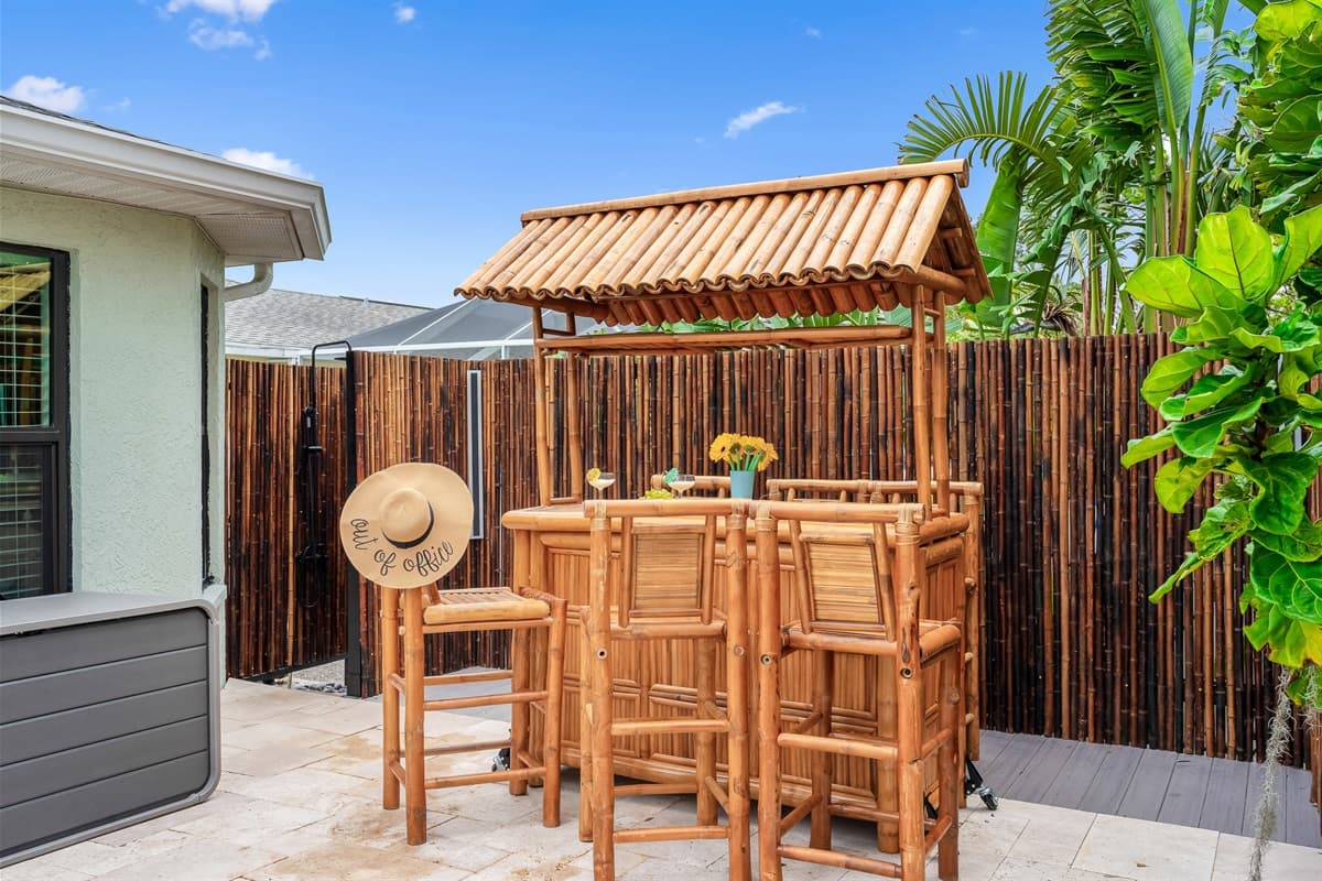 Tiki Bar with Outdoor Shower. Relax at the tropical tiki bar, complete with an outdoor shower for added convenience after a swim or a day in the sun.